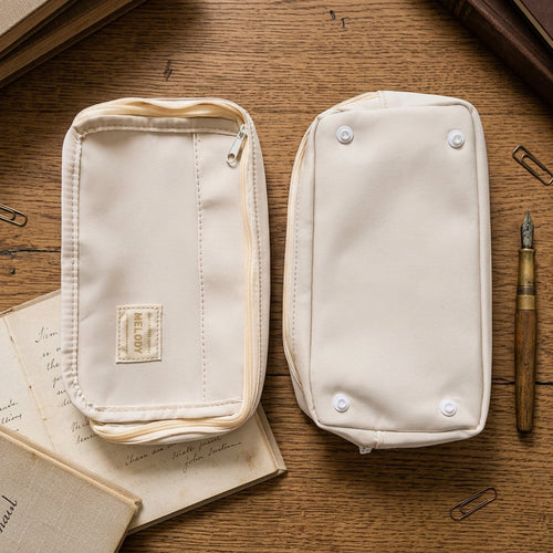 Two beige canvas zippered pouches shown side by side on a white background, displaying both the front zippered exterior and the back with snap closures.