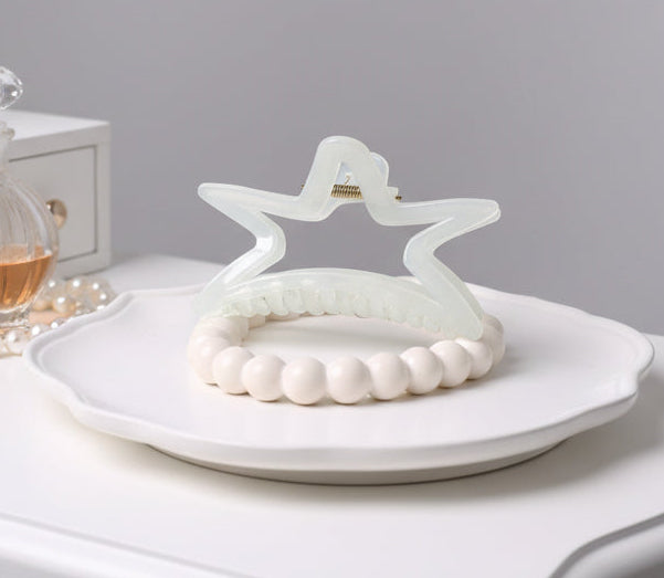 Clear plastic clip on a textured surface