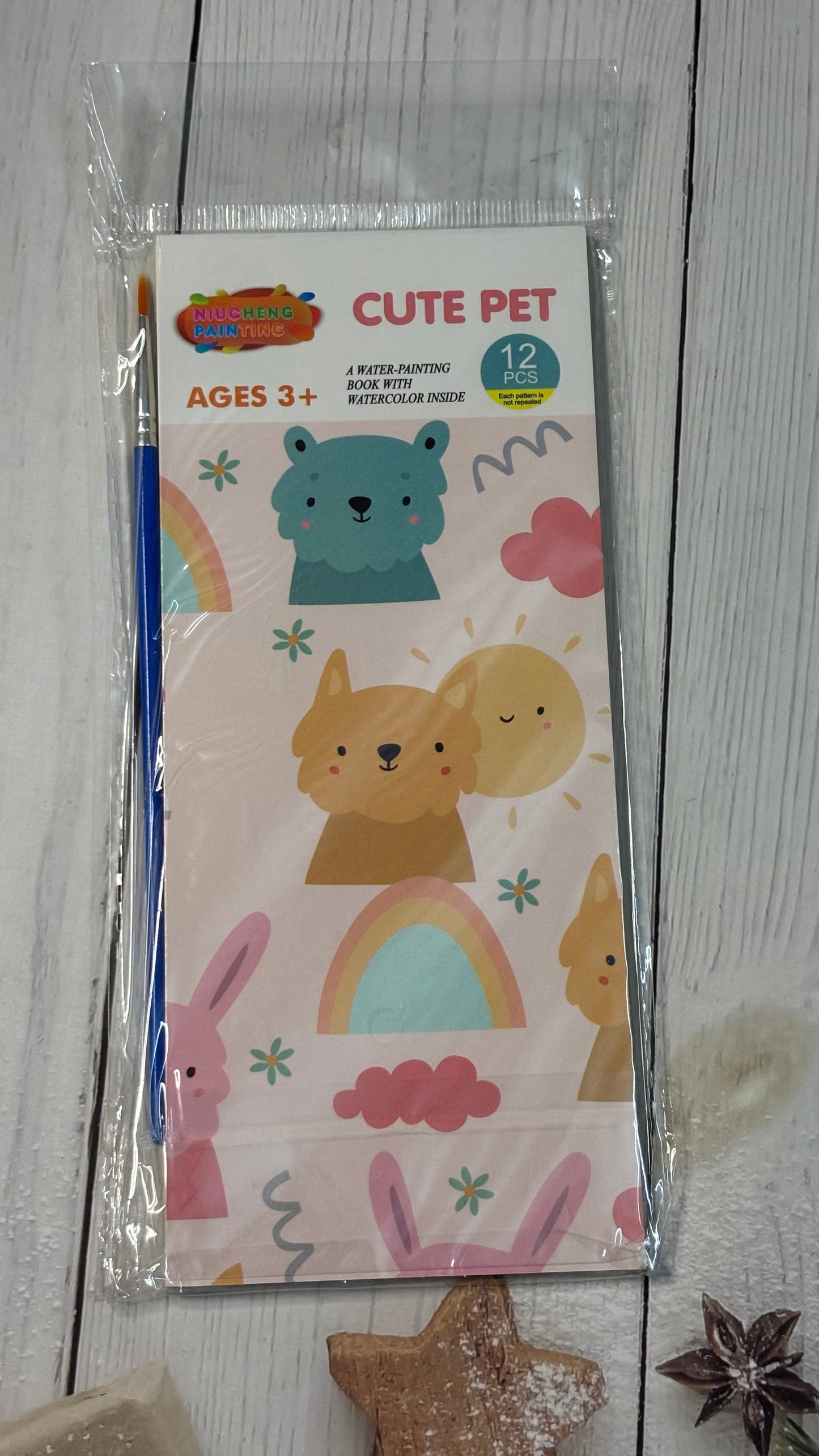 Children's activity book with cartoon animals on a wooden surface