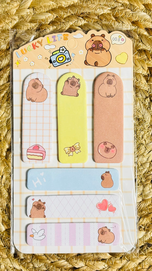 Set of sticky notes with cartoon bear design on a textured background