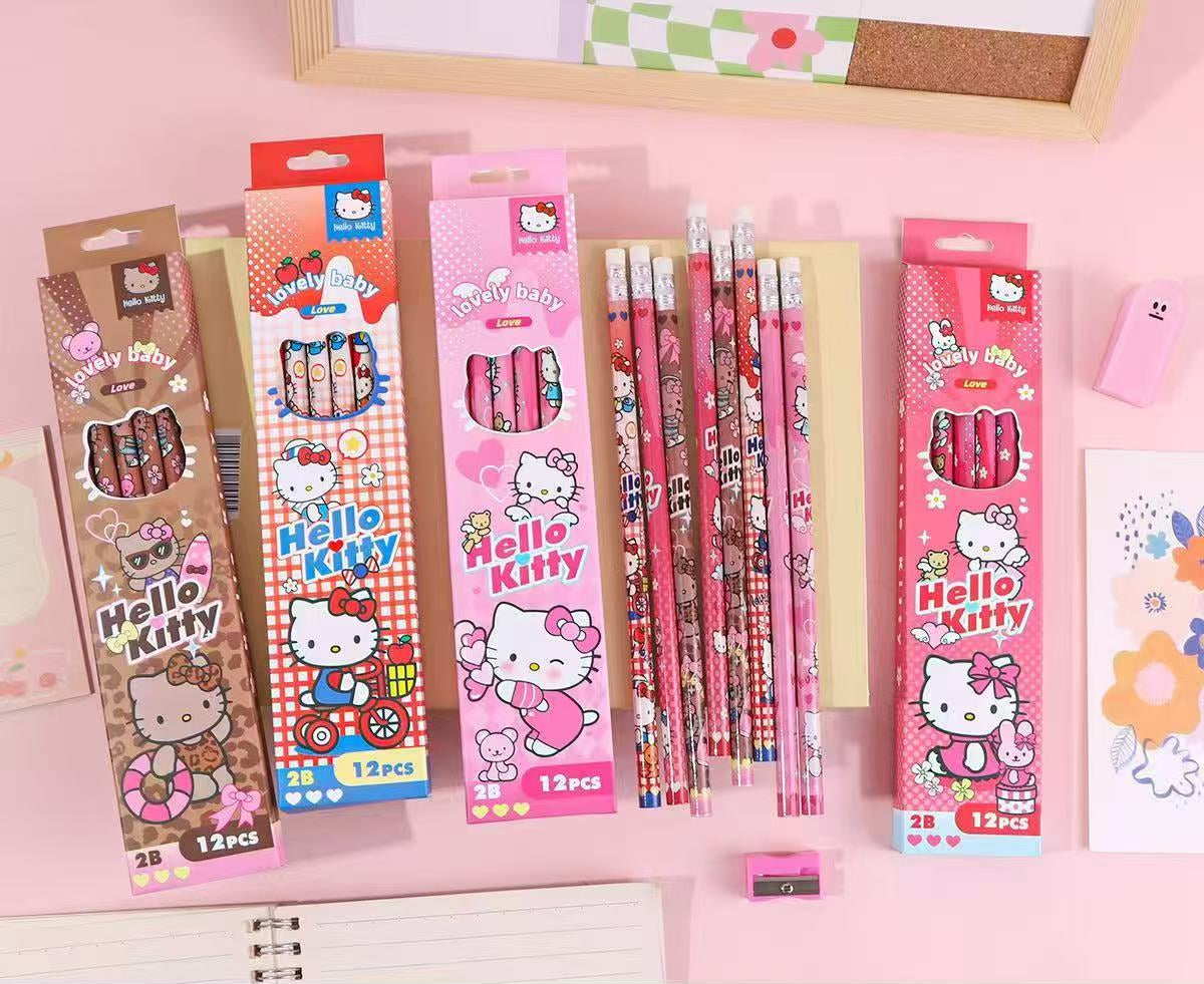 Hello Kitty pencil sets in retail packaging, displayed on a pink surface with product details printed in Chinese at the bottom. The packaging features Hello Kitty branding and cartoon illustrations, with multiple pink, red, and brown boxes and several decorated pencils visible.