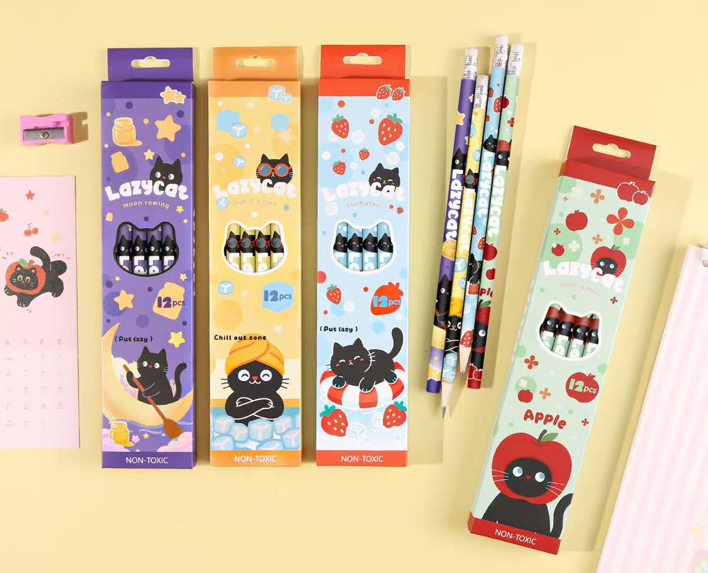 Four boxed sets of cute cartoon pencils arranged on a pale yellow background, with product details printed in Chinese at the bottom. The boxes feature playful cat illustrations and different color schemes including purple, orange, blue, and red.