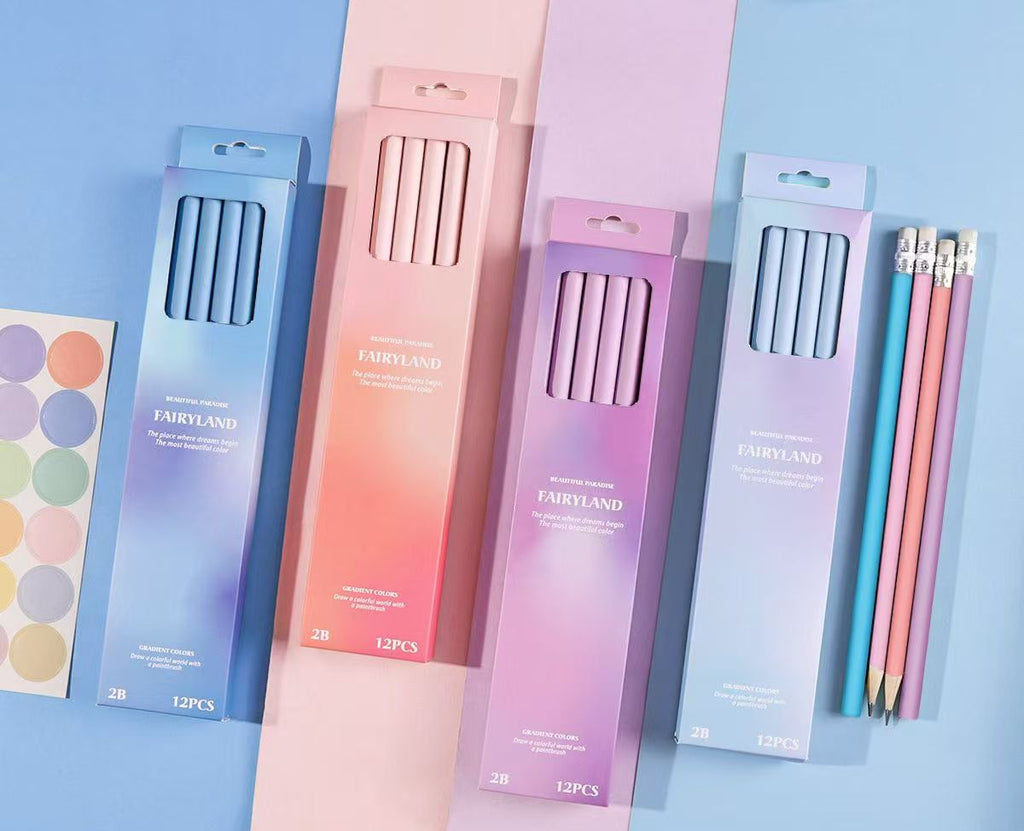 Four pastel gradient boxes of Fairyland 2B pencils arranged on a blue background, with three pencils displayed outside the boxes and Chinese product specifications printed along the bottom.