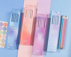 Four pastel gradient boxes of Fairyland 2B pencils arranged on a blue background, with three pencils displayed outside the boxes and Chinese product specifications printed along the bottom.