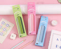 Three boxes of PRETTY NEW 12mm lead pencils in green, pink, and blue, displayed on a pink background with stationery props and Chinese product specifications text at the bottom.