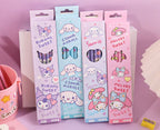 Four pastel-colored My Melody, Cinnamoroll, Kuromi, and Sanrio Melody 2B pencil boxes lined up on a pink surface, with Chinese product specifications printed below.