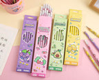 Four pastel-colored pencil boxes with cartoon fruit and animal illustrations, shown on a pink surface with additional pencils around them. Chinese product text and dimensions are printed along the bottom.