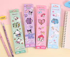 Four pastel-colored pencil boxes with cartoon characters, shown alongside two decorated pencils and a spiral notebook on a pink and beige surface. Chinese product specifications are printed at the bottom.